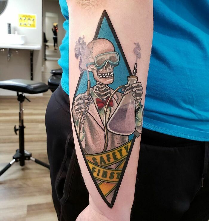 Mad skeleton scientist arm tattoo