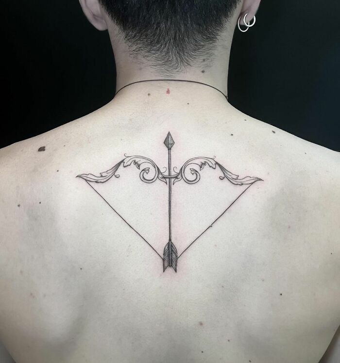 Sagittarius spine tattoo