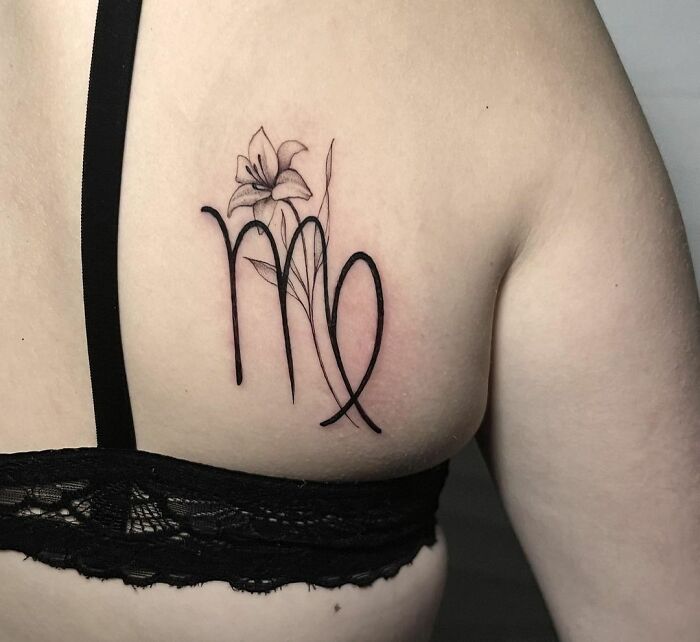 Virgo sign and flower back tattoo