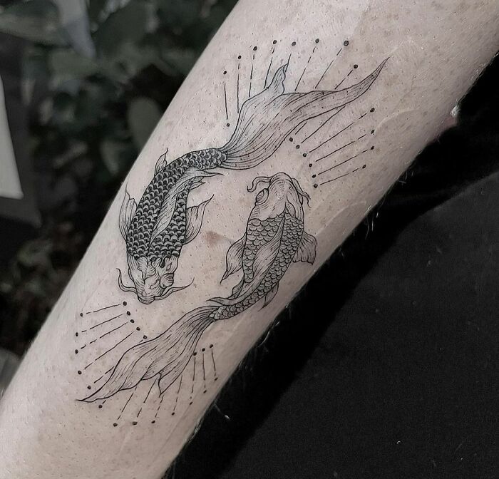 Pisces arm tattoo