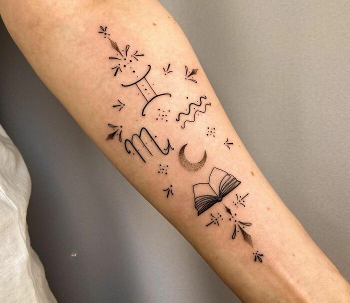 Zodiac tattoos on forearm featuring Gemini, Scorpio symbols, and celestial motifs.