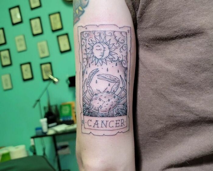 Cancer sign as a Tarot card arm tattoo