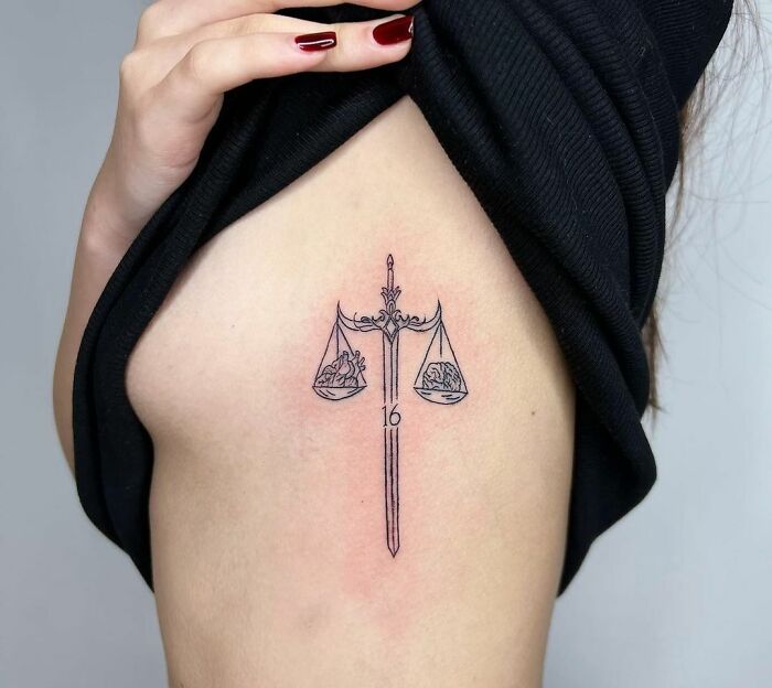 Libra ribs tattoo