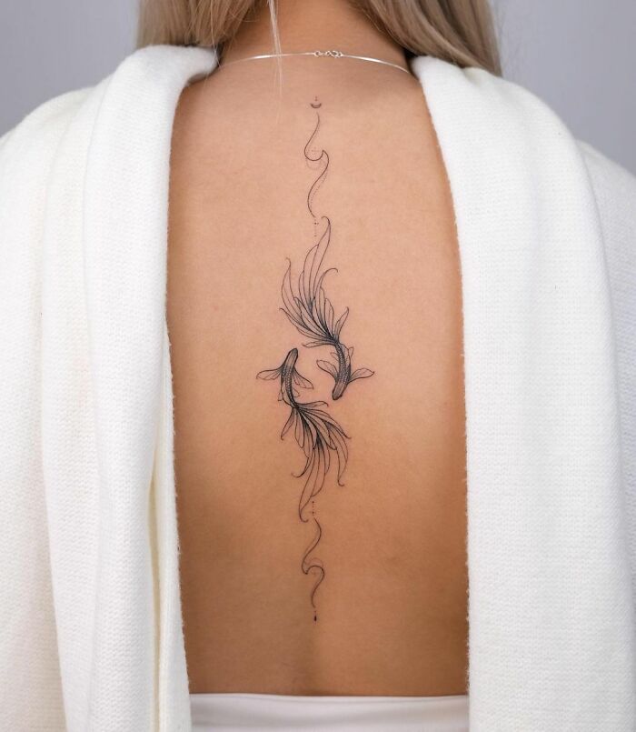 Pisces spine back tattoo