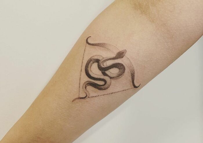 Sagittarius snake and crossbow tattoo