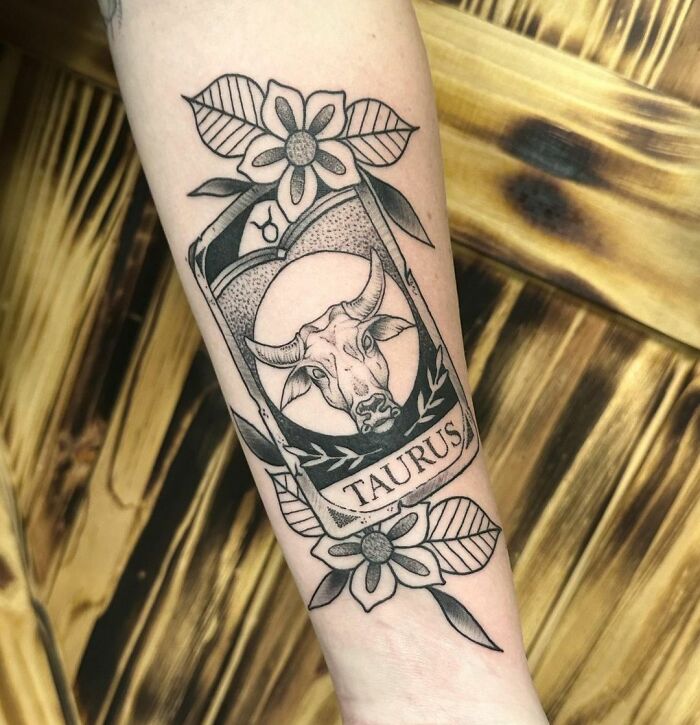 Taurus in a card arm tattoo