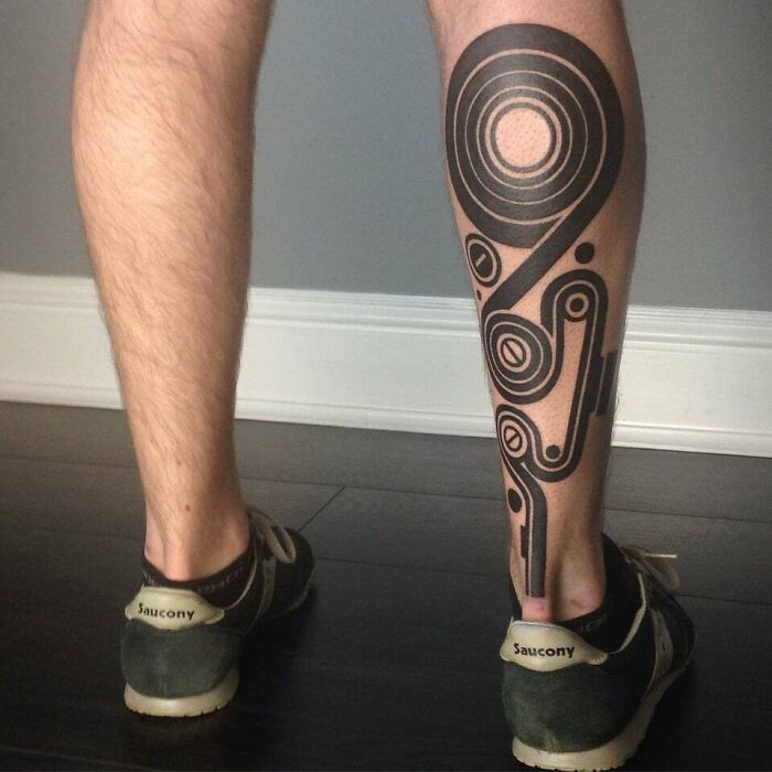 Geometric Blackwork Abstraction leg tattoo 