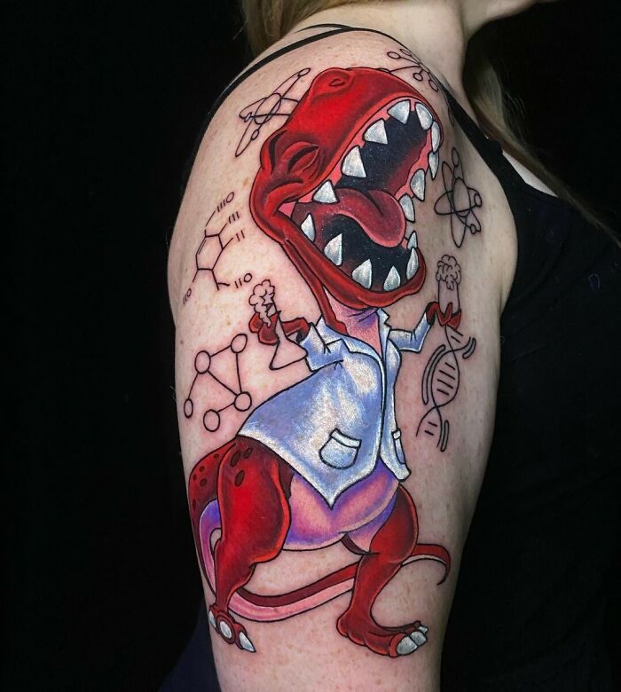 Red dinosaur scientist tattoo on arm