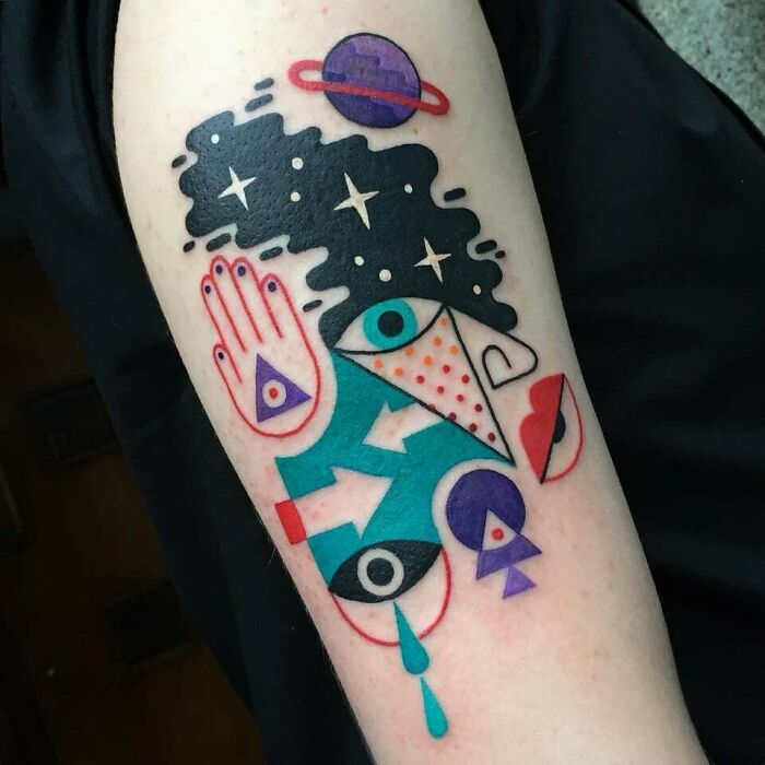 Abstract and colorful arm Tattoo