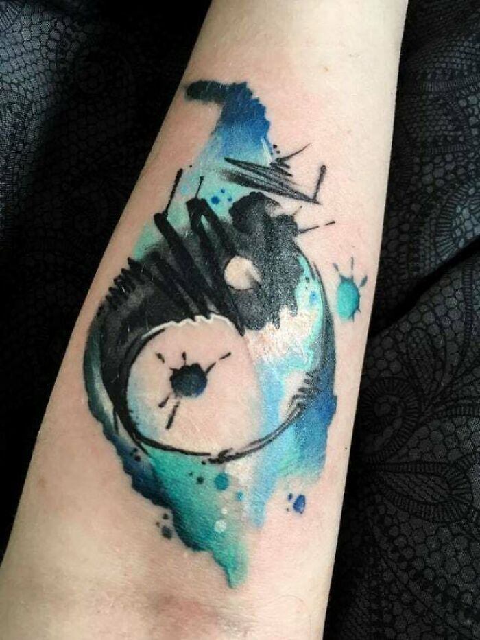 Abstract and colorful Yin Yang hand Tattoo