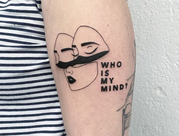 "Who is my mind?" with faces tattoo 