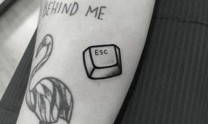 Escape button tattoo 