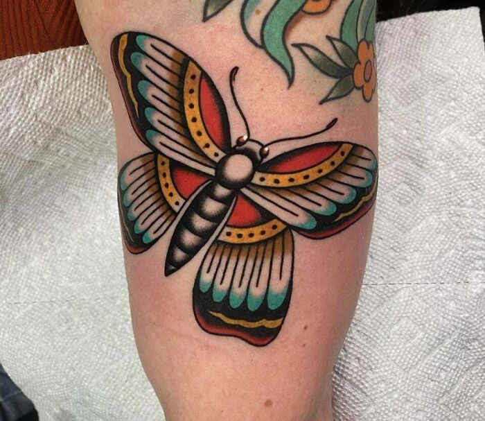 Big colorful butterfly arm tattoo