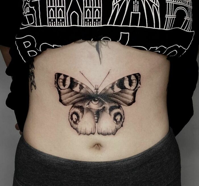 Butterfly With Human Eye stomach Tattoo