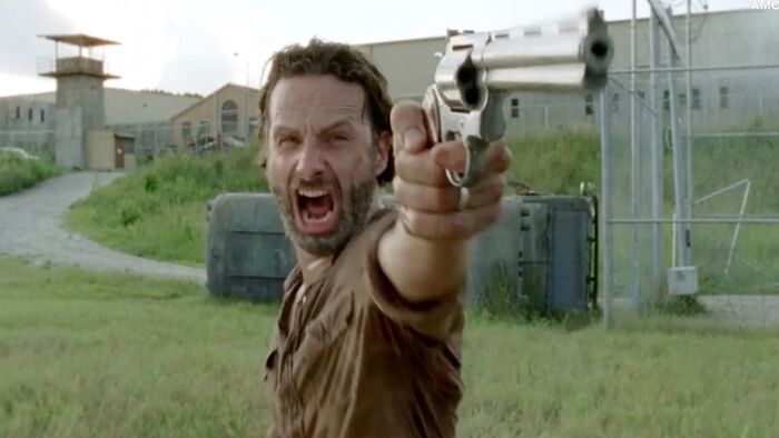 Rick Grimes screaming while holding gun
