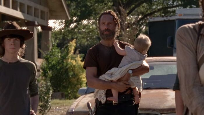 Rick Grimes holding child 