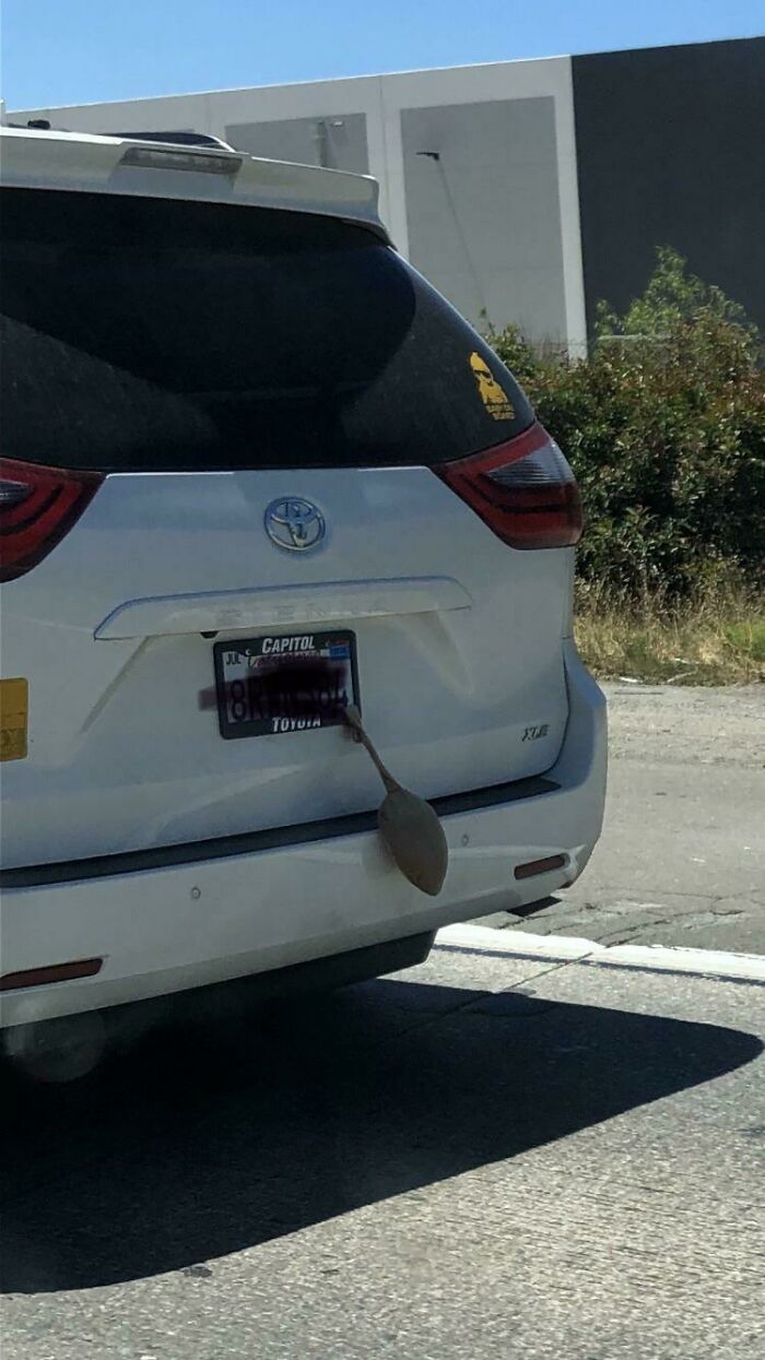 What Is The Light Brown/Tan Pouch Dangling From The License Plate Frame?