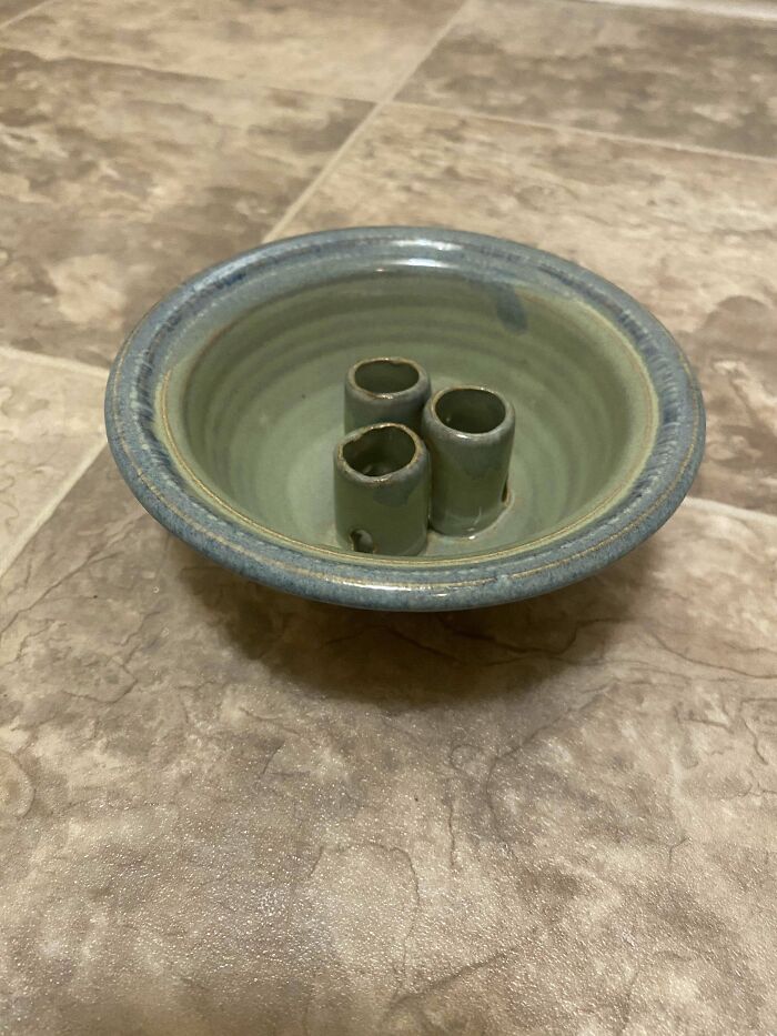 Small Ceramic Bowl With Three Small Cones Like Things In The Middle
