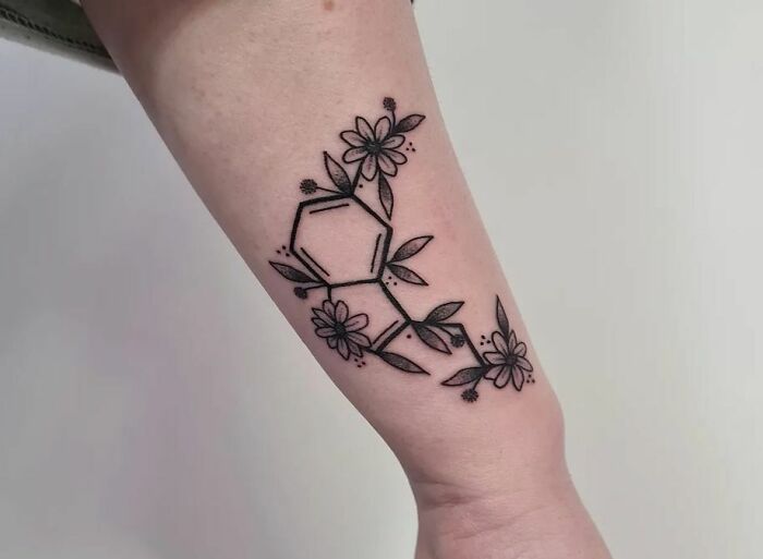 Serotonin molecule with flowers tattoo
