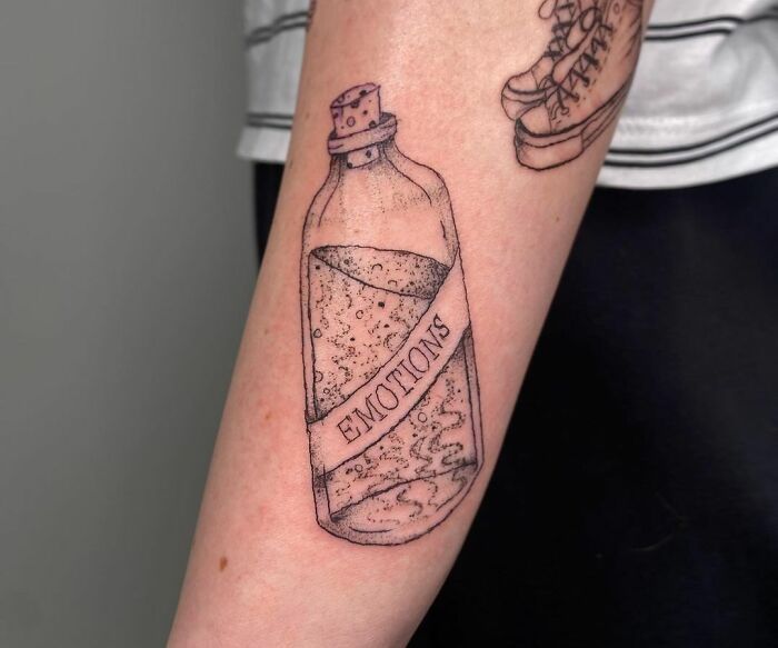 Bottle with emotions arm tattoo 