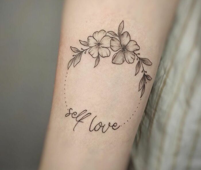 'Self love" with flowers tattoo 