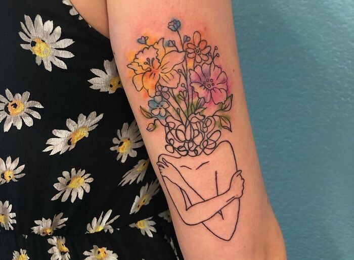 Flower head tattoo
