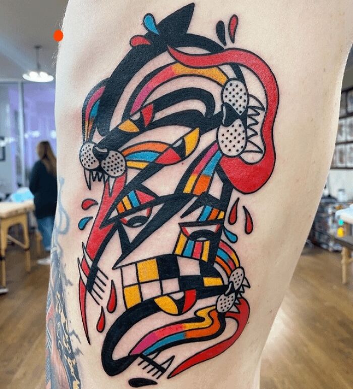 Abstract and colorful cheekbone Tattoo 