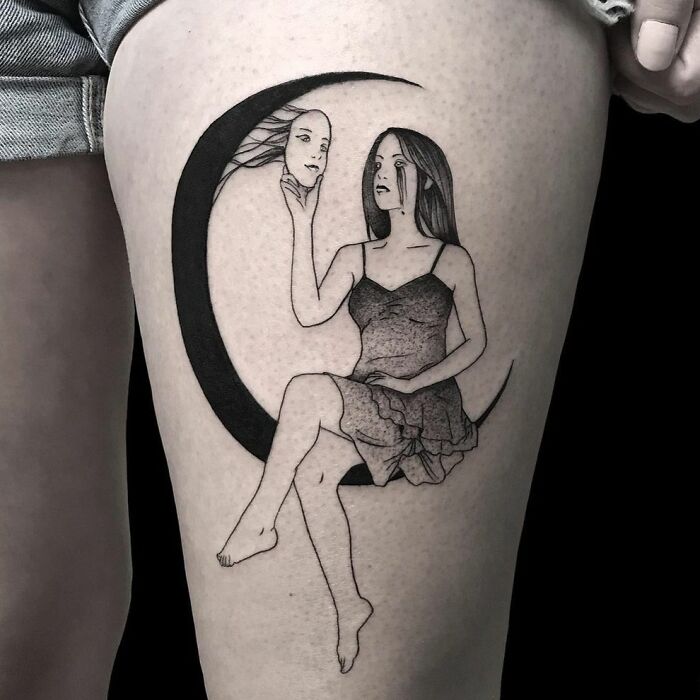 Woman sitting on the moon holding a mask tattoo 