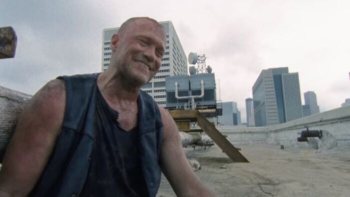 Merle Dixon sitting and laughing 