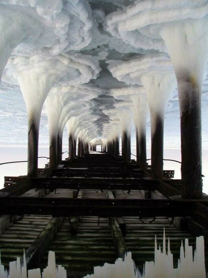 If You Turn The "Frozen Water Under A Pier" Photo Upside Down It Turns Into An Industrial Cityscape