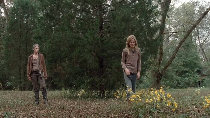 Lizzie looking at the flowers and crying 