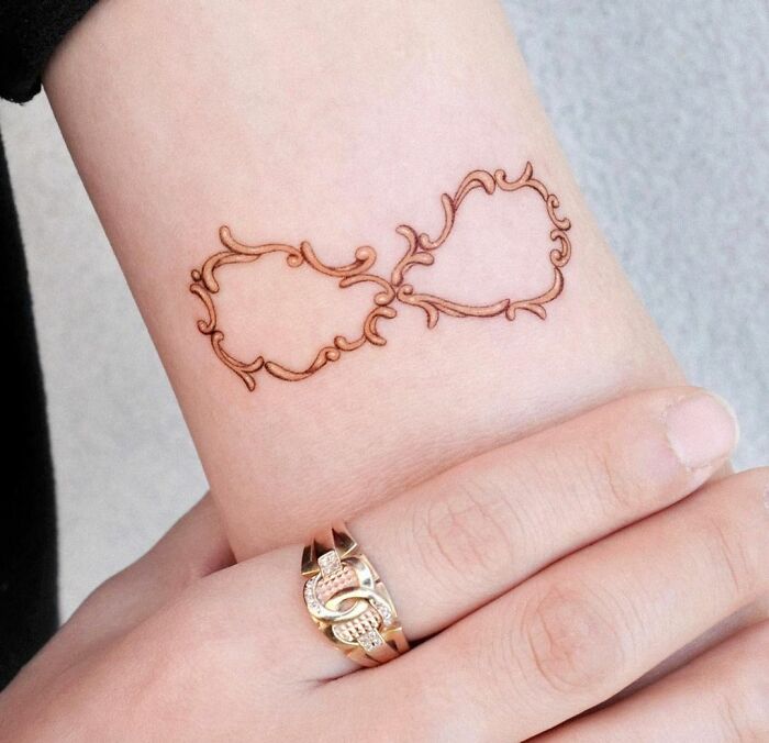 antique style infinity tattoo