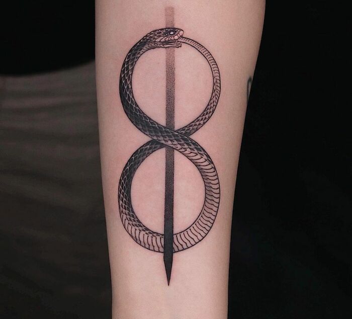 Snake shaped infinity symbol tattoo 