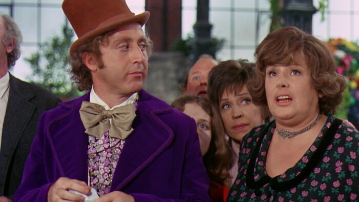 Willy Wonka looking at Mrs. Gloop 