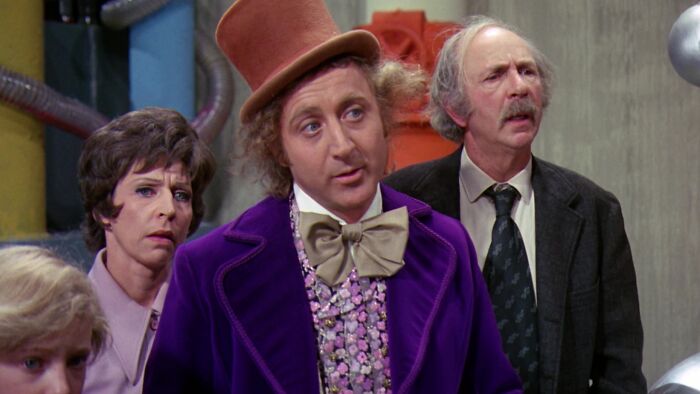 Willy Wonka with his guests 