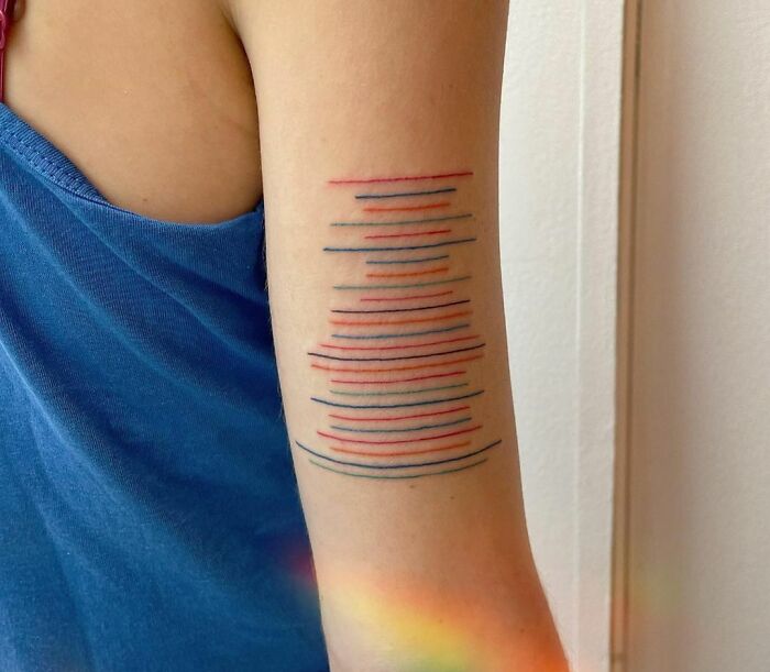Abstract and colorful arm Tattoo 