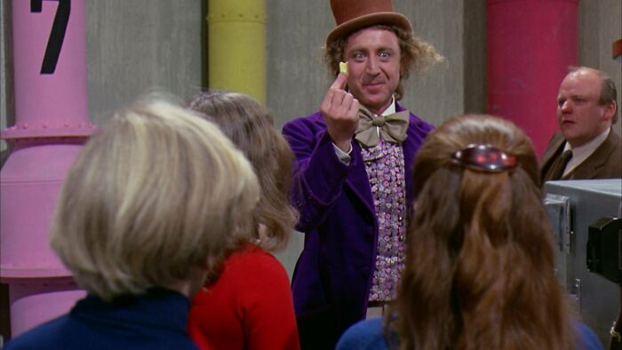 Willy Wonka showing a gum 