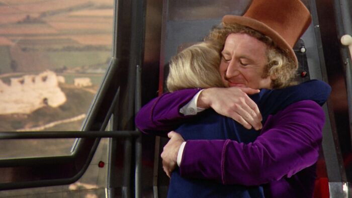 Willy Wonka hugging Charlie 