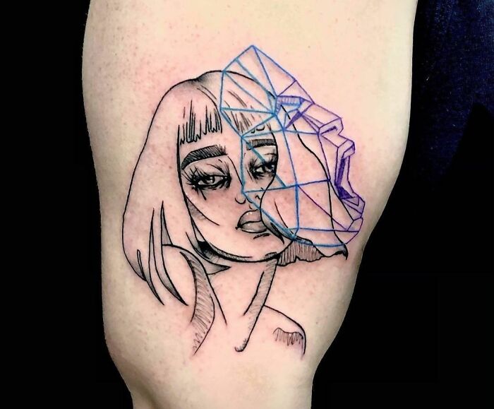 Female face with geometrical face next to it showing the real emotions tattoo