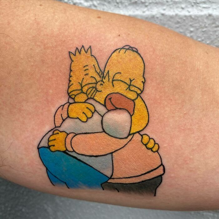 Homer Simpson and Abraham Simpson hugging tattoo