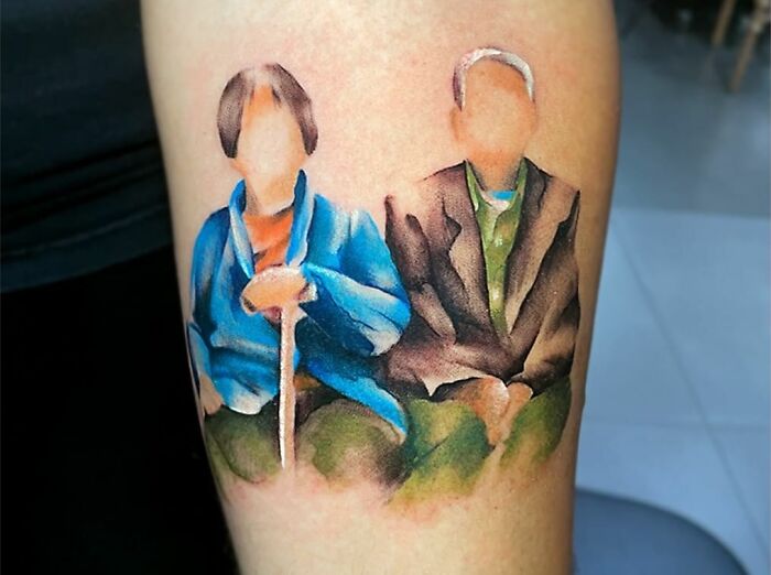 Colorful picture of grandparents graphic forearm tattoo
