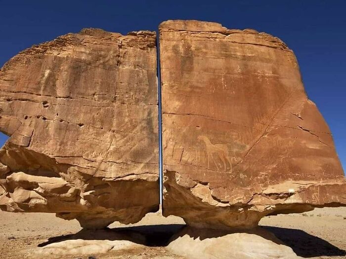 The 4,000-Year-Old Al Naslaa Rock Formation Has A Mystery Laser-Like Cut Through Its Center This Incredible Pair Of Standing Stones Of Al-Naslaa, Is Located At The Tayma Oasis In Saudi Arabia And Of Course, It Looks Like A Huge Boulder Cut In Half With Laser-Like Precision