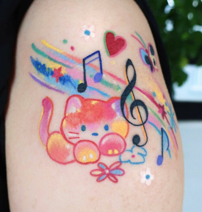 Colorful music tattoo with cat, butterflies and notes