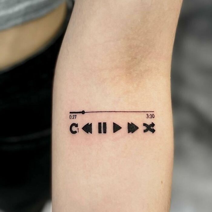Black audio control buttons tattoo