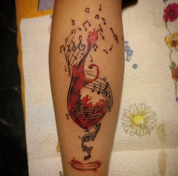 Music and red wine tattoo