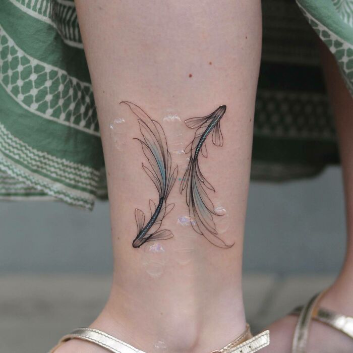 Two fishes forming yin yang symbol tattoo