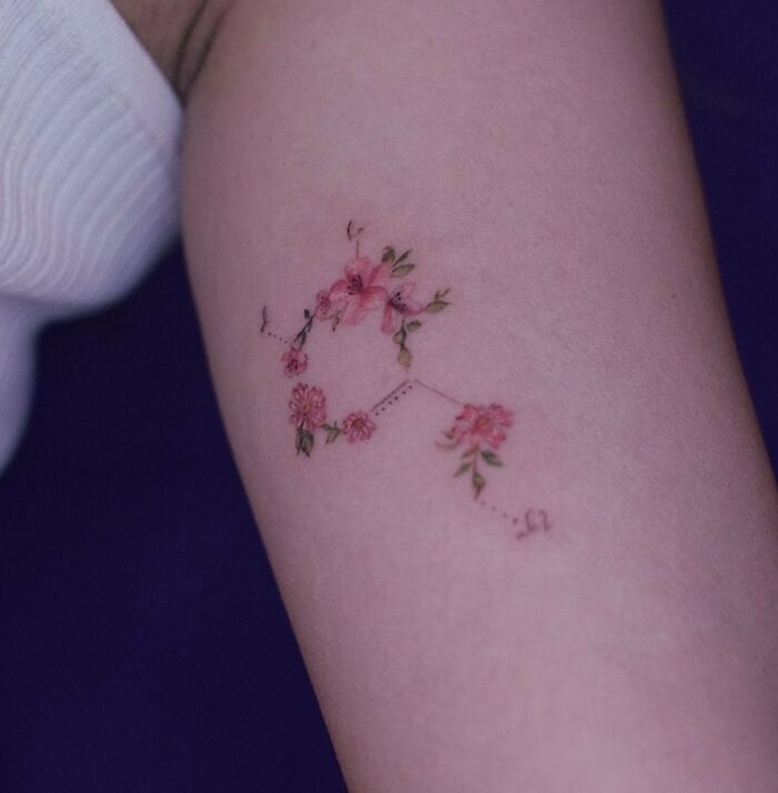 Delicate floral dopamine molecule arm tattoo