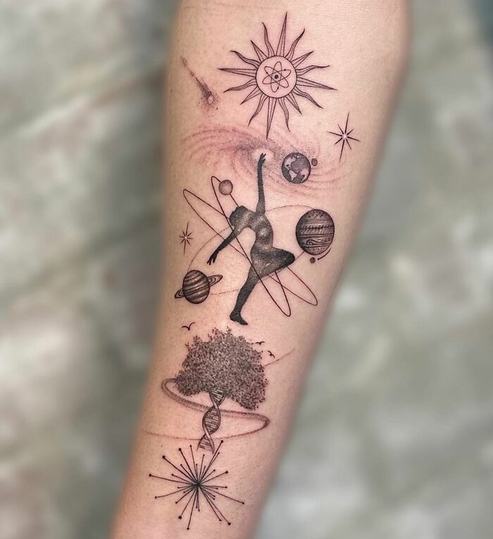 Galaxy, man and tree tattoo on arm