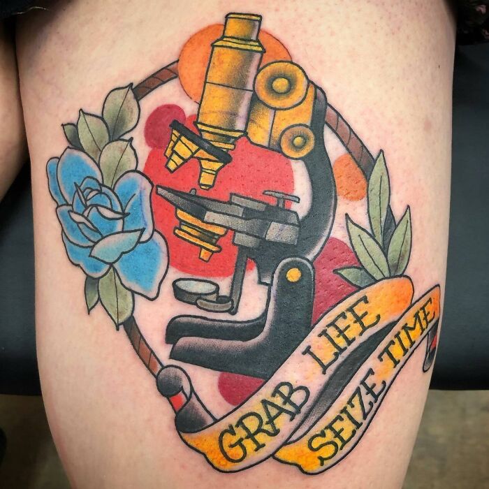 Colorful microscope and flower tattoo