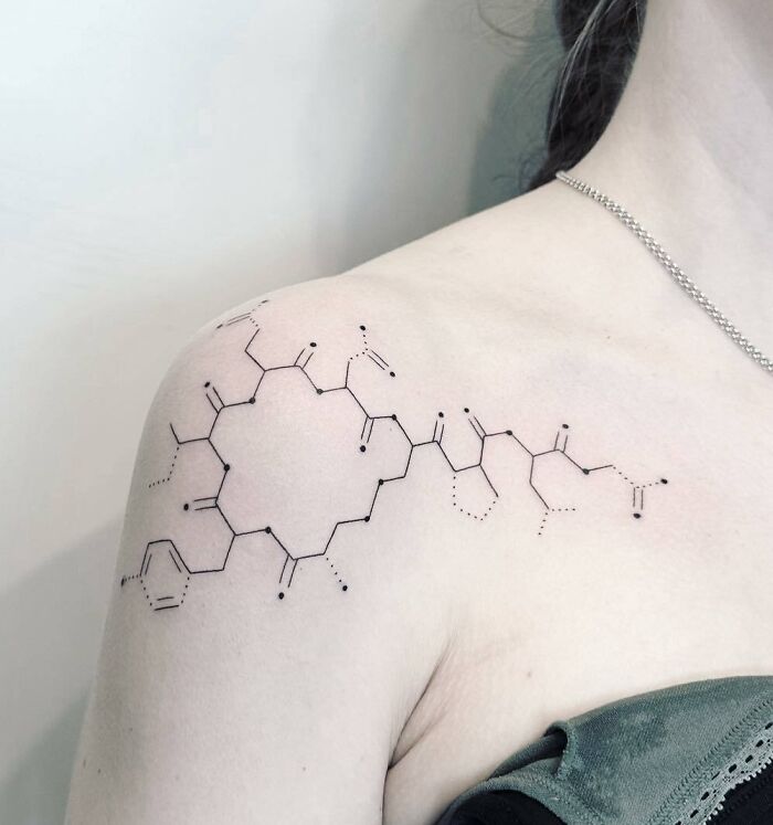 Oxytocin molecule tattoo on shoulder